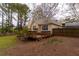 Private backyard featuring a deck, two-story home, and grass at 10 Flowers Dr, Covington, GA 30014
