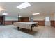 Spacious basement with tile flooring, half-wall paneling, and room for entertainment at 10 Flowers Dr, Covington, GA 30014