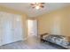 Bedroom with a double closet, bed, and view of adjacent room at 10 Flowers Dr, Covington, GA 30014