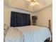 Bedroom with a bed, tray ceiling, ceiling fan, and television at 10 Flowers Dr, Covington, GA 30014
