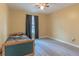 Bedroom with laminate flooring, comfortable bed, and window with curtains at 10 Flowers Dr, Covington, GA 30014