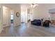 Open living room featuring modern laminate floors, neutral walls, and high ceilings at 10 Flowers Dr, Covington, GA 30014