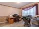 Home office setup with two desks and ample workspace under decorative floral wallpaper at 10 Flowers Dr, Covington, GA 30014
