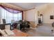 Home office area with a stone fireplace and a glimpse into the vaulted living area at 10 Flowers Dr, Covington, GA 30014