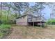 A quaint home features a wooden deck perfect for outdoor enjoyment and entertaining at 1248 W Ridge Ave, Stone Mountain, GA 30083