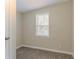 A bedroom with carpeting and a window with blinds at 1248 W Ridge Ave, Stone Mountain, GA 30083