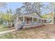 A charming home with a covered front porch and well-maintained landscaping at 1248 W Ridge Ave, Stone Mountain, GA 30083