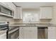 Well-appointed kitchen with granite countertops and stainless steel dishwasher at 1248 W Ridge Ave, Stone Mountain, GA 30083