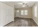 Cozy living room featuring neutral walls, window and closet space and hardwood floors at 1248 W Ridge Ave, Stone Mountain, GA 30083
