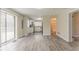 Bright living space featuring hardwood floors, deck access, and an adjacent kitchen at 1248 W Ridge Ave, Stone Mountain, GA 30083