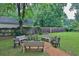 Spacious backyard featuring benches, chairs, and a firepit, perfect for outdoor gatherings at 2344 Johnson Ferry Ne Rd, Atlanta, GA 30341