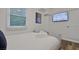 Bedroom features hardwood floors, television and window at 2344 Johnson Ferry Ne Rd, Atlanta, GA 30341