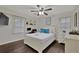 Bright bedroom with hardwood floors, a ceiling fan, and a built-in desk area at 2344 Johnson Ferry Ne Rd, Atlanta, GA 30341