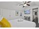 View of bedroom with a TV, seating for two, and neutral decor at 2344 Johnson Ferry Ne Rd, Atlanta, GA 30341