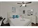 Bedroom with white furnishings, blue pillows, and ceiling fan at 2344 Johnson Ferry Ne Rd, Atlanta, GA 30341