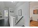 Bright hallway with hardwood floors and framed artwork on the walls at 2344 Johnson Ferry Ne Rd, Atlanta, GA 30341