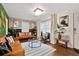 Inviting living room with modern furniture, a decorative lighting fixture, and bright natural light at 2344 Johnson Ferry Ne Rd, Atlanta, GA 30341