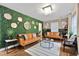 Stylish living room featuring a unique green wall, modern furniture, and elegant decor at 2344 Johnson Ferry Ne Rd, Atlanta, GA 30341