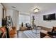 Well-decorated living room with comfortable seating, a stylish coffee table, and a large TV at 2344 Johnson Ferry Ne Rd, Atlanta, GA 30341