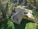 Aerial view of a house showcasing its backyard, fence, and surrounding greenery at 2535 Judson Ave, East Point, GA 30344
