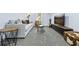 Basement living room with a gray couch, a flat screen TV, and modern decor at 2535 Judson Ave, East Point, GA 30344