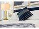 Comfortable bedroom with a decorative navy pillow and soft, white bedding at 2535 Judson Ave, East Point, GA 30344