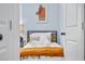 Bright bedroom with a simple bed and an open doorway at 2535 Judson Ave, East Point, GA 30344