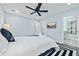 Bright bedroom featuring a ceiling fan, a graphic rug, and ensuite bathroom at 2535 Judson Ave, East Point, GA 30344