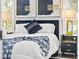 Comfortable bedroom featuring a plush bed with elegant lamps, creating a serene and inviting space at 2535 Judson Ave, East Point, GA 30344
