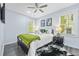 Bright bedroom with matching bedside tables and ensuite bathroom access at 2535 Judson Ave, East Point, GA 30344