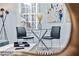 Bright dining area featuring a glass table with black chairs and modern artwork, providing an inviting atmosphere at 2535 Judson Ave, East Point, GA 30344