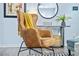 Comfortable living room chair with a stylish throw blanket, set against a modern decor backdrop with wood flooring at 2535 Judson Ave, East Point, GA 30344