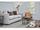 Modern basement living room featuring a comfortable sofa, natural light, and stylish decor at 2535 Judson Ave, East Point, GA 30344