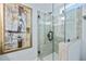 Modern shower with clear glass door, tile surround, and a rainfall shower head at 2535 Judson Ave, East Point, GA 30344