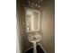 Clean and simple powder room featuring a pedestal sink and decorative lighting at 4244 Old House Dr, Conley, GA 30288