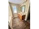 Well-lit bathroom features a double sink vanity, and vinyl flooring at 4244 Old House Dr, Conley, GA 30288