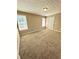 Bedroom featuring carpeted flooring, neutral walls, and two windows that provide natural light at 4244 Old House Dr, Conley, GA 30288