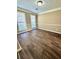 Comfortable bedroom with stylish flooring, neutral walls, and plenty of natural light at 4244 Old House Dr, Conley, GA 30288