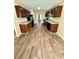 Modern kitchen with dark wood cabinets, granite countertops, and stainless steel appliances at 4244 Old House Dr, Conley, GA 30288