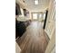 Well-lit kitchen with dark cabinets, modern appliances, and stylish wood-look flooring at 4244 Old House Dr, Conley, GA 30288