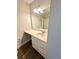 Bright bathroom features a vanity with drawers and a mirror with vanity lighting at 5050 Martins Crossing Rd, Stone Mountain, GA 30088