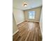 Bedroom featuring a window and wood-look tile flooring at 5050 Martins Crossing Rd, Stone Mountain, GA 30088