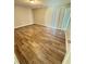 Living room featuring a window and wood-look tile flooring at 5050 Martins Crossing Rd, Stone Mountain, GA 30088