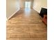 Spacious living room featuring sleek wood-look tile flooring at 5050 Martins Crossing Rd, Stone Mountain, GA 30088