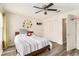 Comfortable bedroom with ceiling fan, closet, and playful planet decor, perfect for children at 813 Ridgefield Dr, Peachtree City, GA 30269