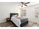 Bright bedroom with wood floors, a ceiling fan, and two windows that offer plenty of natural light at 813 Ridgefield Dr, Peachtree City, GA 30269