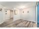 Bright dining room featuring wood-look floors and nautical-themed decorations, adjacent to the front door at 813 Ridgefield Dr, Peachtree City, GA 30269