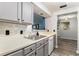 Stylish kitchen featuring modern appliances, updated countertops, and a seamless flow into the dining area at 813 Ridgefield Dr, Peachtree City, GA 30269