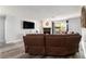 Cozy living room with a fireplace, large sectional sofa, and sliding glass doors to a patio at 813 Ridgefield Dr, Peachtree City, GA 30269