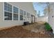 Backyard featuring stepping stone path, white fence, and view of the sunroom at 2130 Birkdale St, Villa Rica, GA 30180